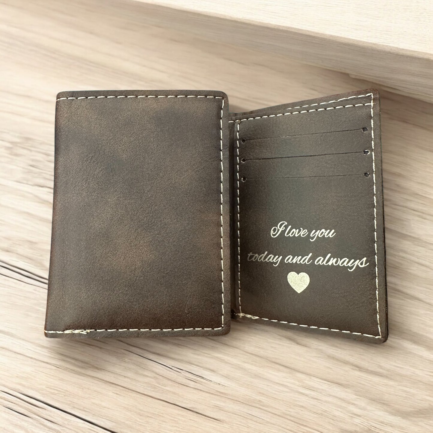 Personalized leather tri-fold wallet.